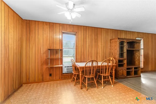 an empty room with furniture and wooden floor