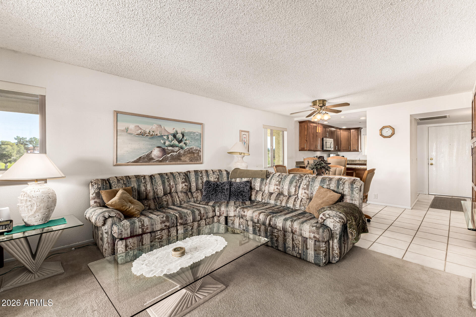 4150 East Cactus Road, Unit 210 Phoenix, AZ 85032 - Photo 10 of 45 a living room with furniture and a lamp