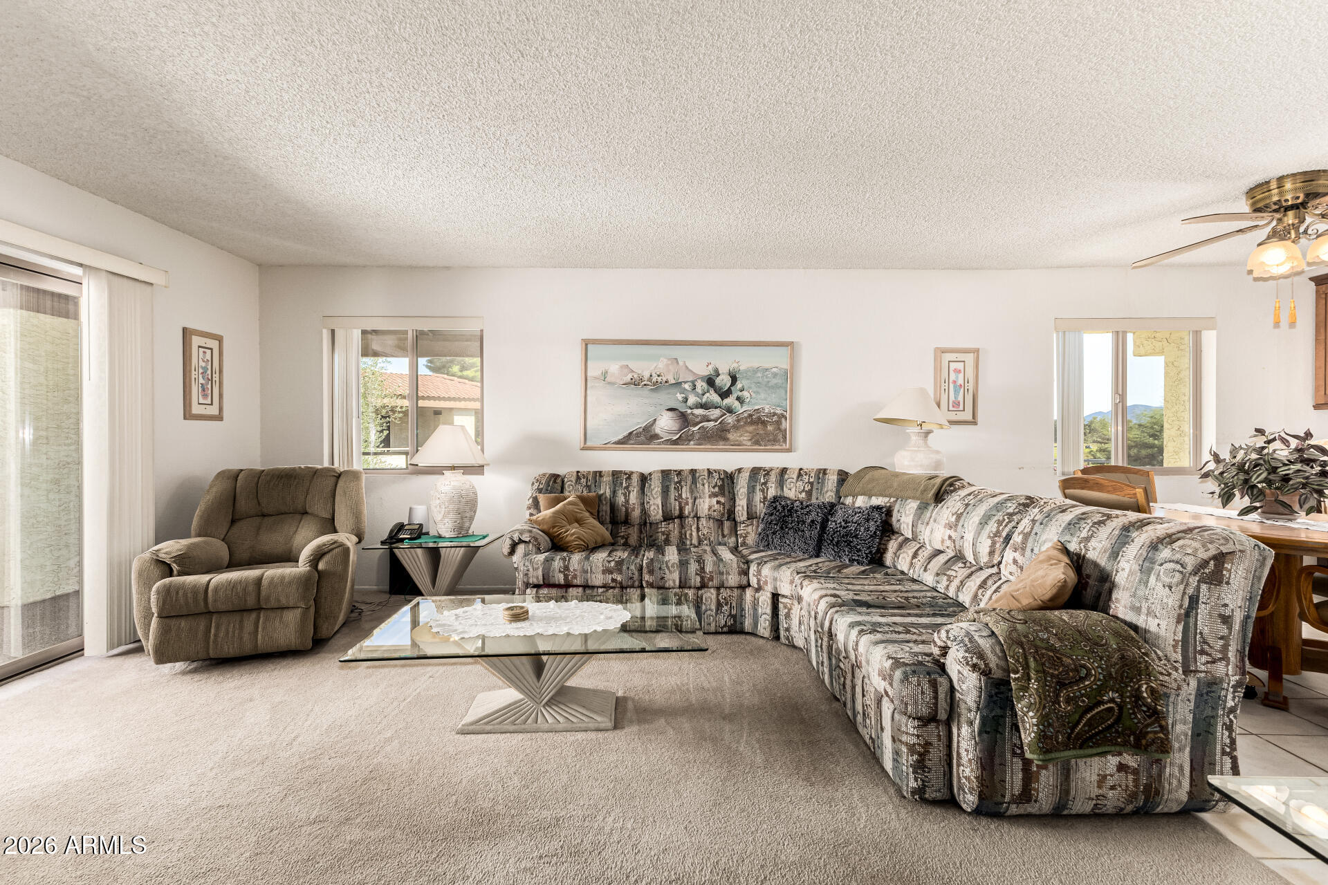 4150 East Cactus Road, Unit 210 Phoenix, AZ 85032 - Photo 12 of 45 a living room with furniture and a large window