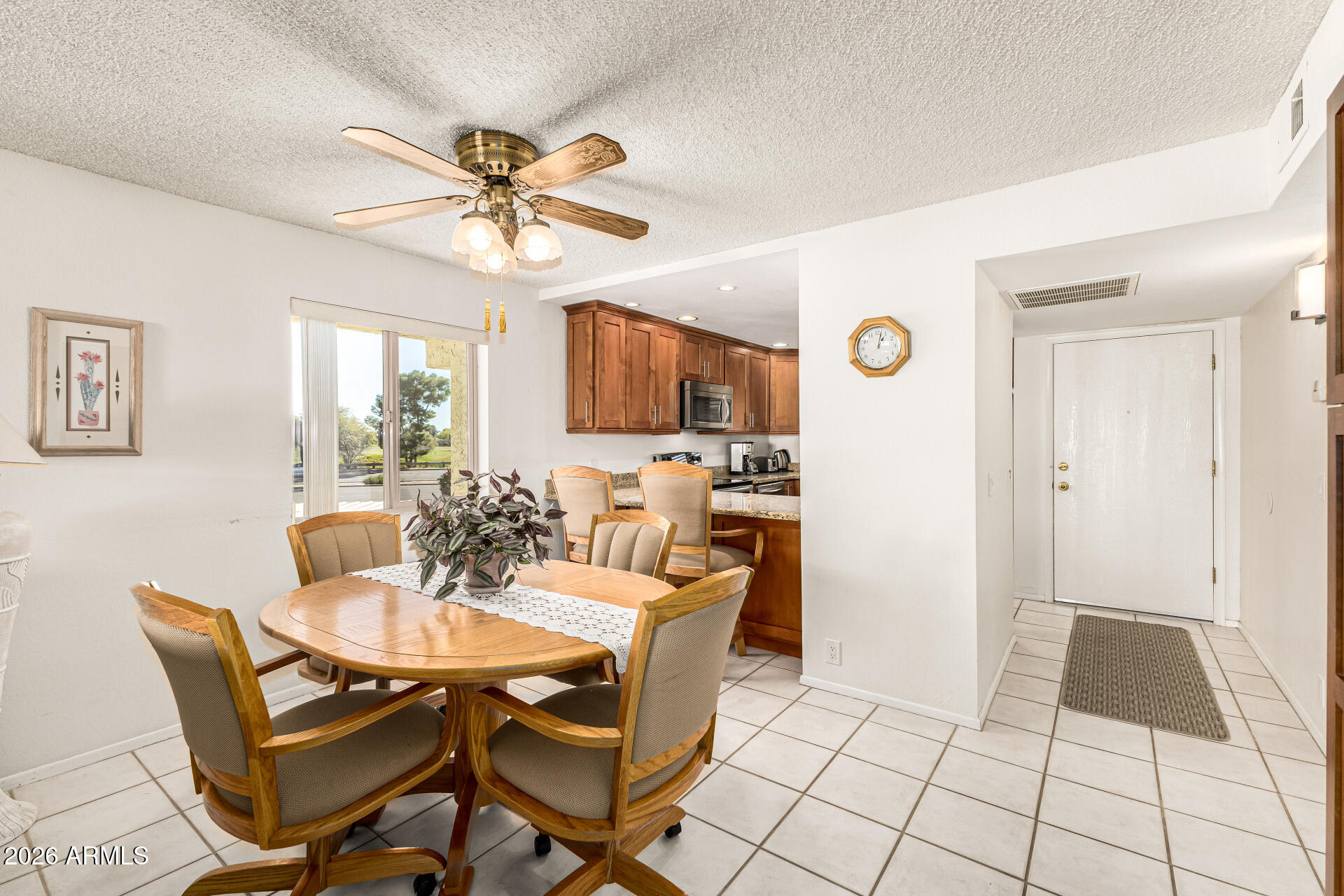 4150 East Cactus Road, Unit 210 Phoenix, AZ 85032 - Photo 13 of 45 a dining room with furniture and window