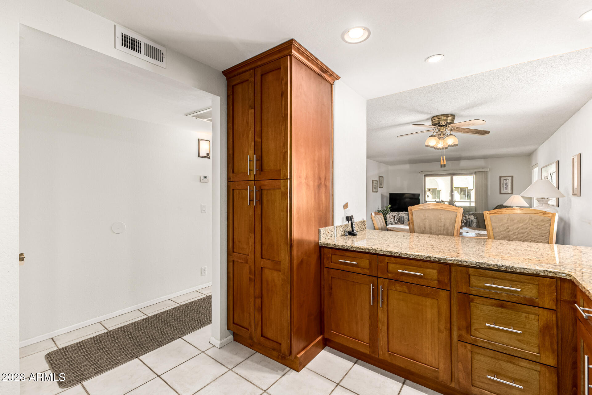 4150 East Cactus Road, Unit 210 Phoenix, AZ 85032 - Photo 17 of 45 a en suite bathroom with a granite countertop sink and a mirror