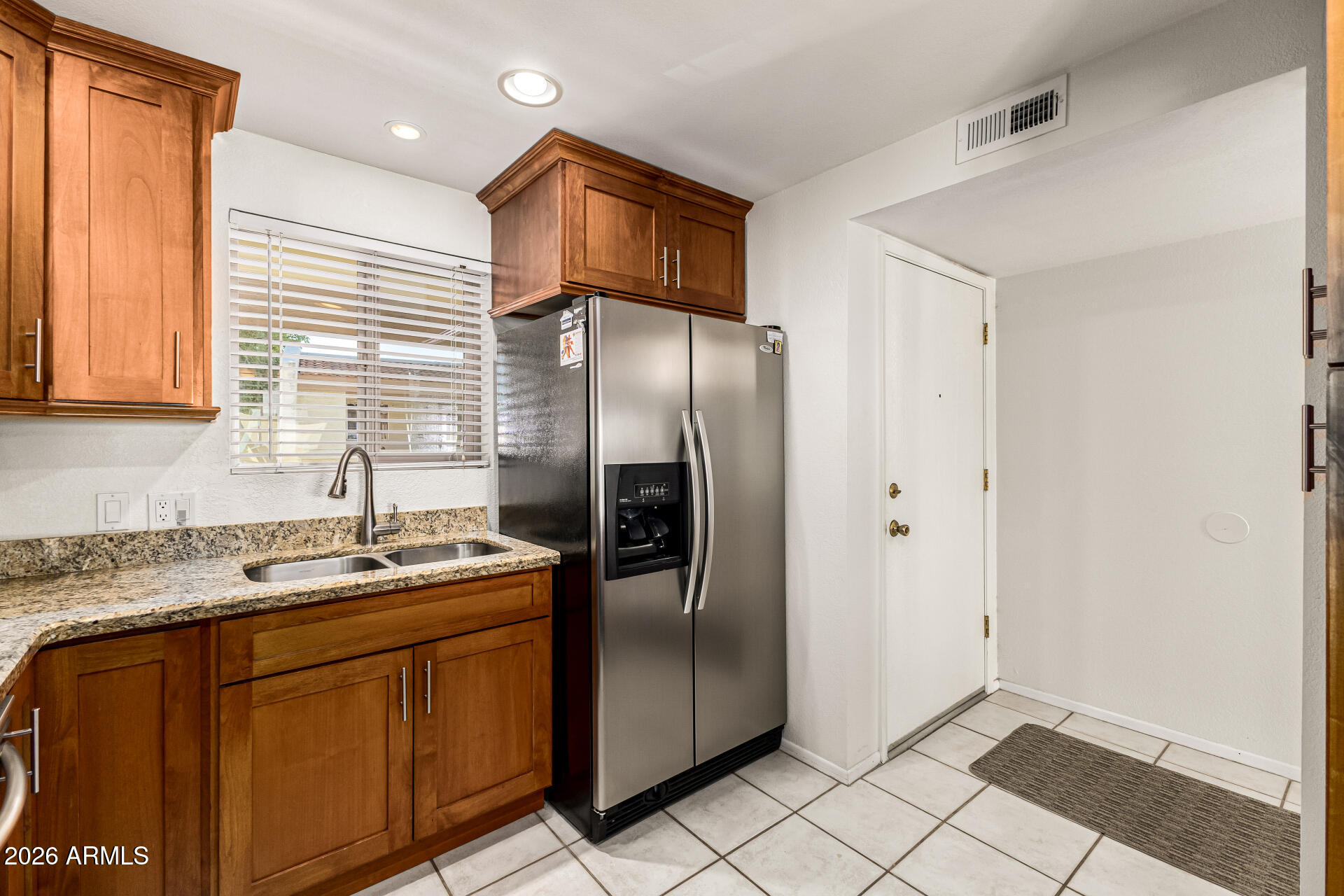 4150 East Cactus Road, Unit 210 Phoenix, AZ 85032 - Photo 18 of 45 a kitchen with stainless steel appliances granite countertop a refrigerator a sink and dishwasher