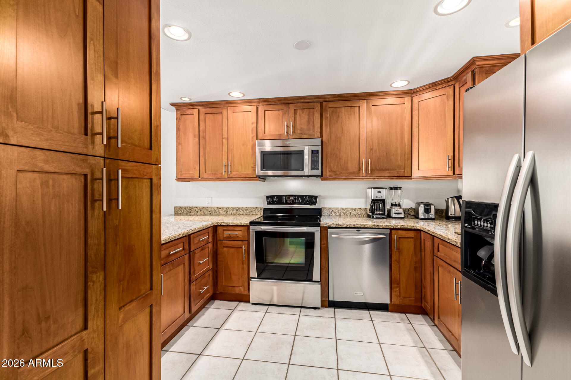 4150 East Cactus Road, Unit 210 Phoenix, AZ 85032 - Photo 2 of 45 a kitchen with stainless steel appliances granite countertop a stove top oven a sink and dishwasher