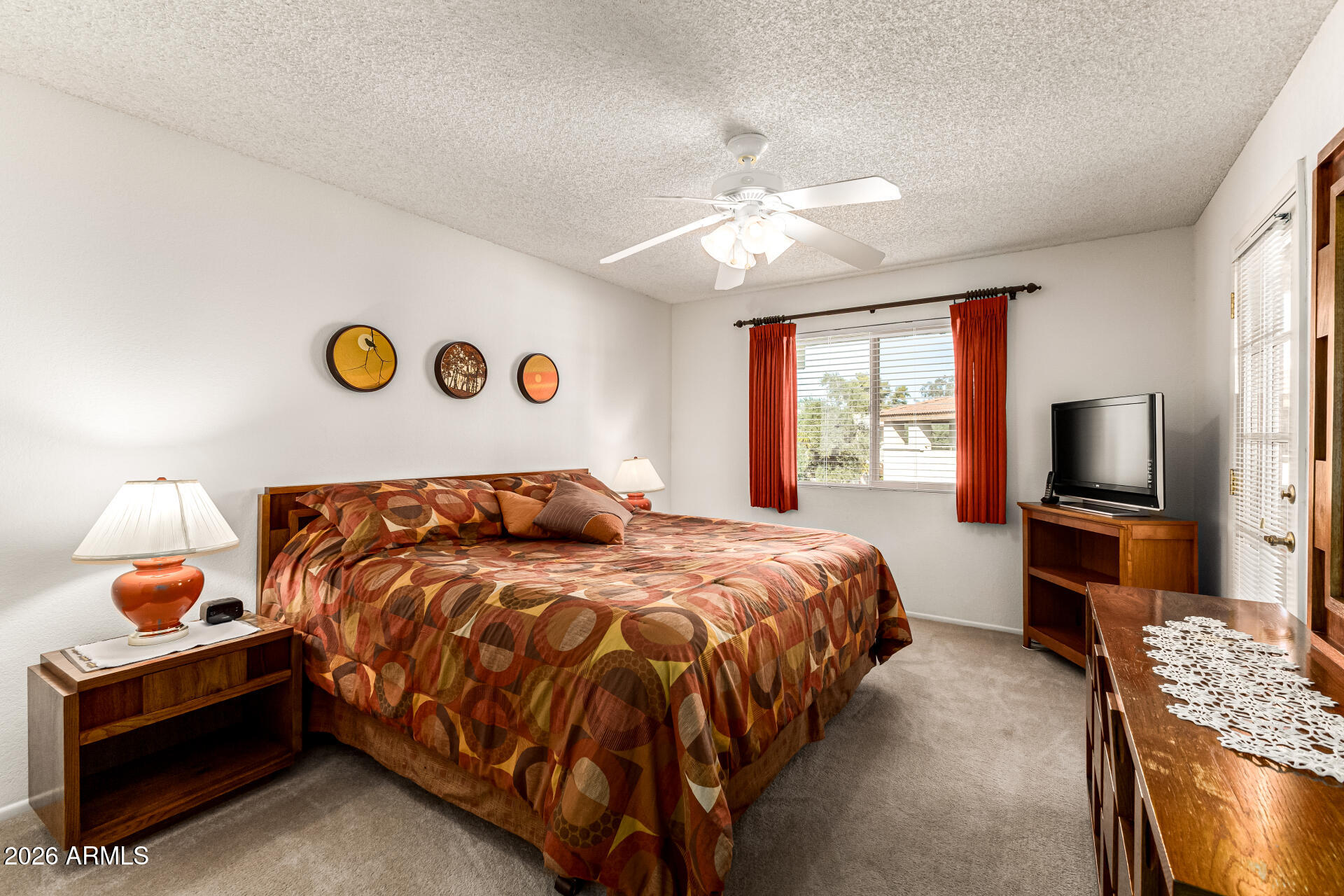 4150 East Cactus Road, Unit 210 Phoenix, AZ 85032 - Photo 20 of 45 a bedroom with a bed and a flat screen tv