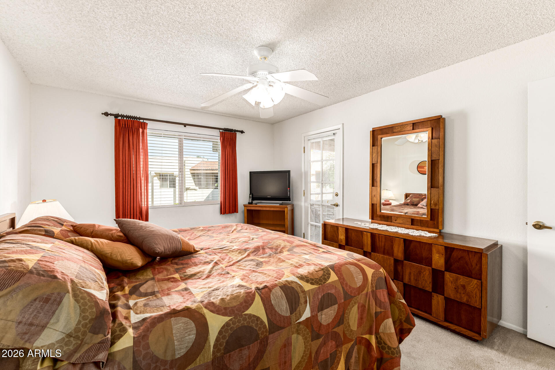 4150 East Cactus Road, Unit 210 Phoenix, AZ 85032 - Photo 22 of 45 a bedroom with a large bed and a window