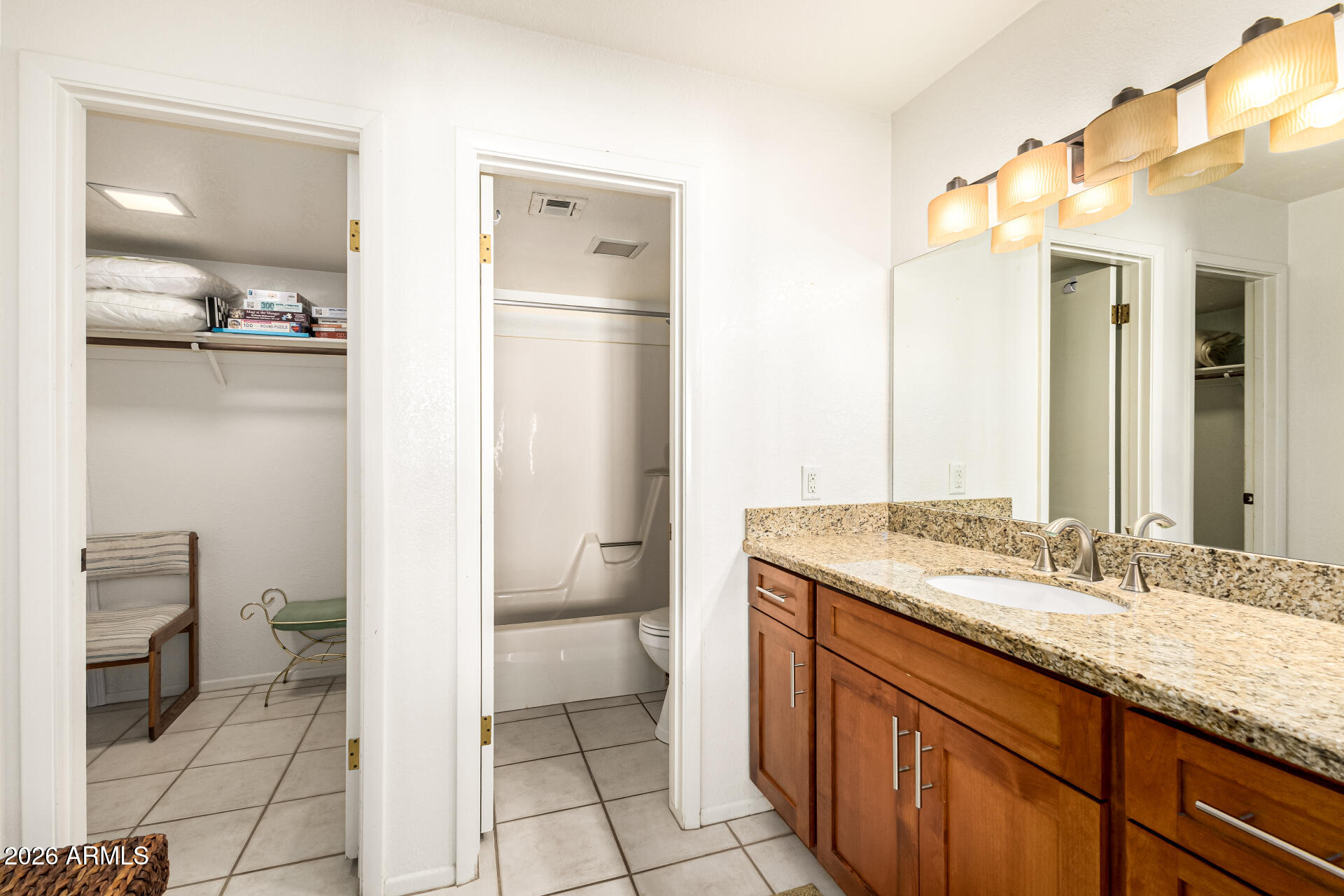 4150 East Cactus Road, Unit 210 Phoenix, AZ 85032 - Photo 23 of 45 a bathroom with a granite countertop sink toilet and shower