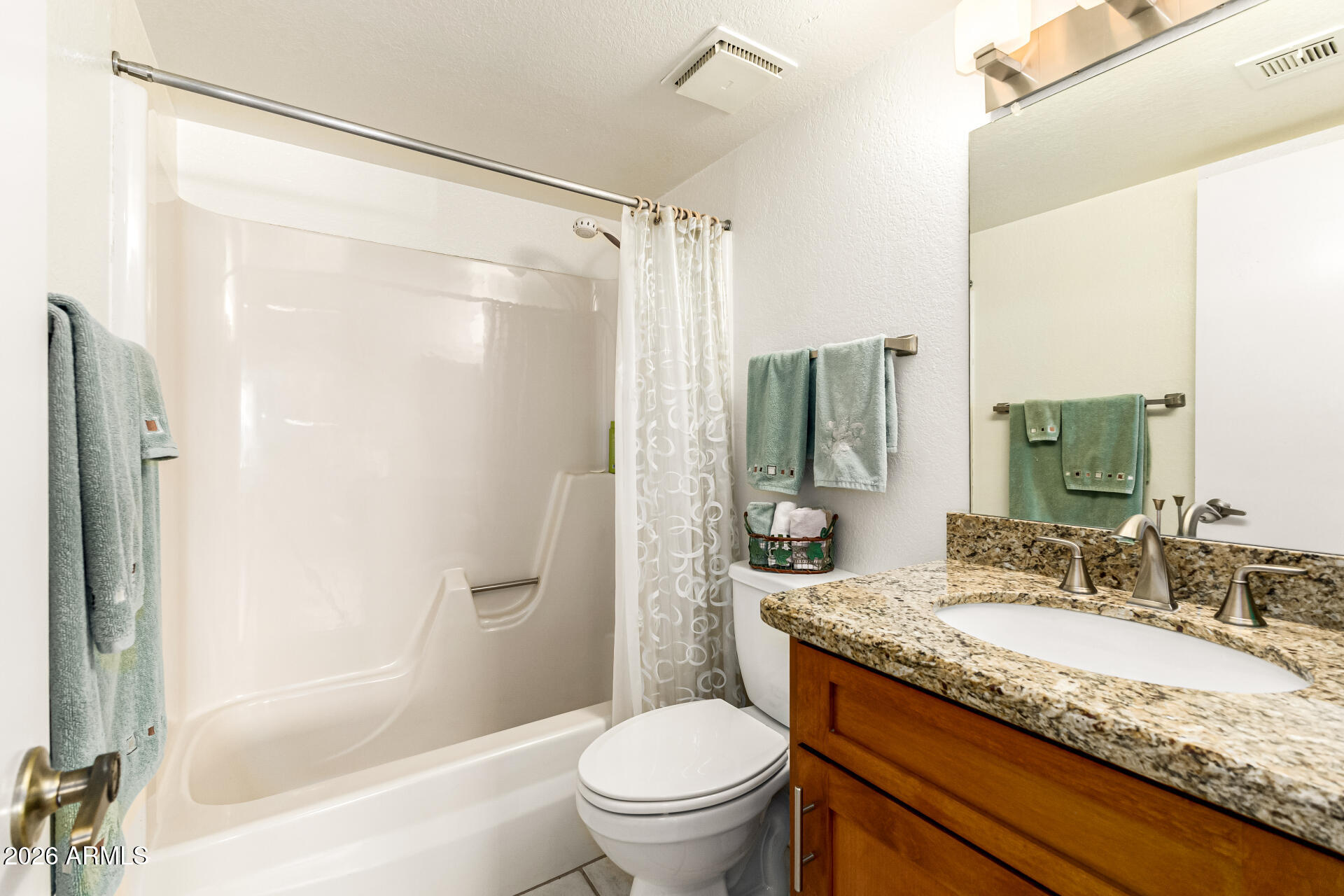 4150 East Cactus Road, Unit 210 Phoenix, AZ 85032 - Photo 30 of 45 a bathroom with a granite countertop sink toilet and shower