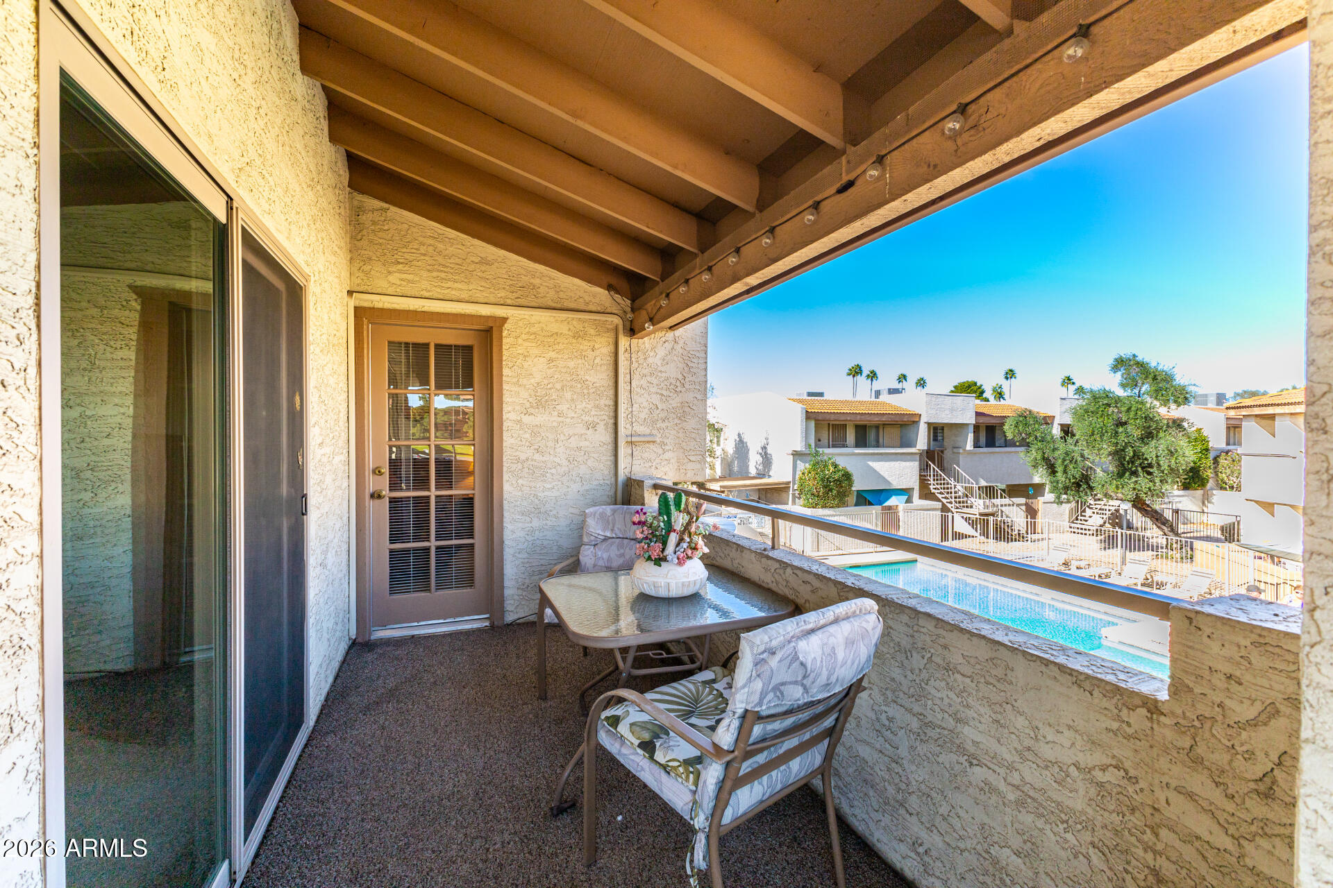 4150 East Cactus Road, Unit 210 Phoenix, AZ 85032 - Photo 34 of 45 a dining room with furniture and a floor to ceiling window