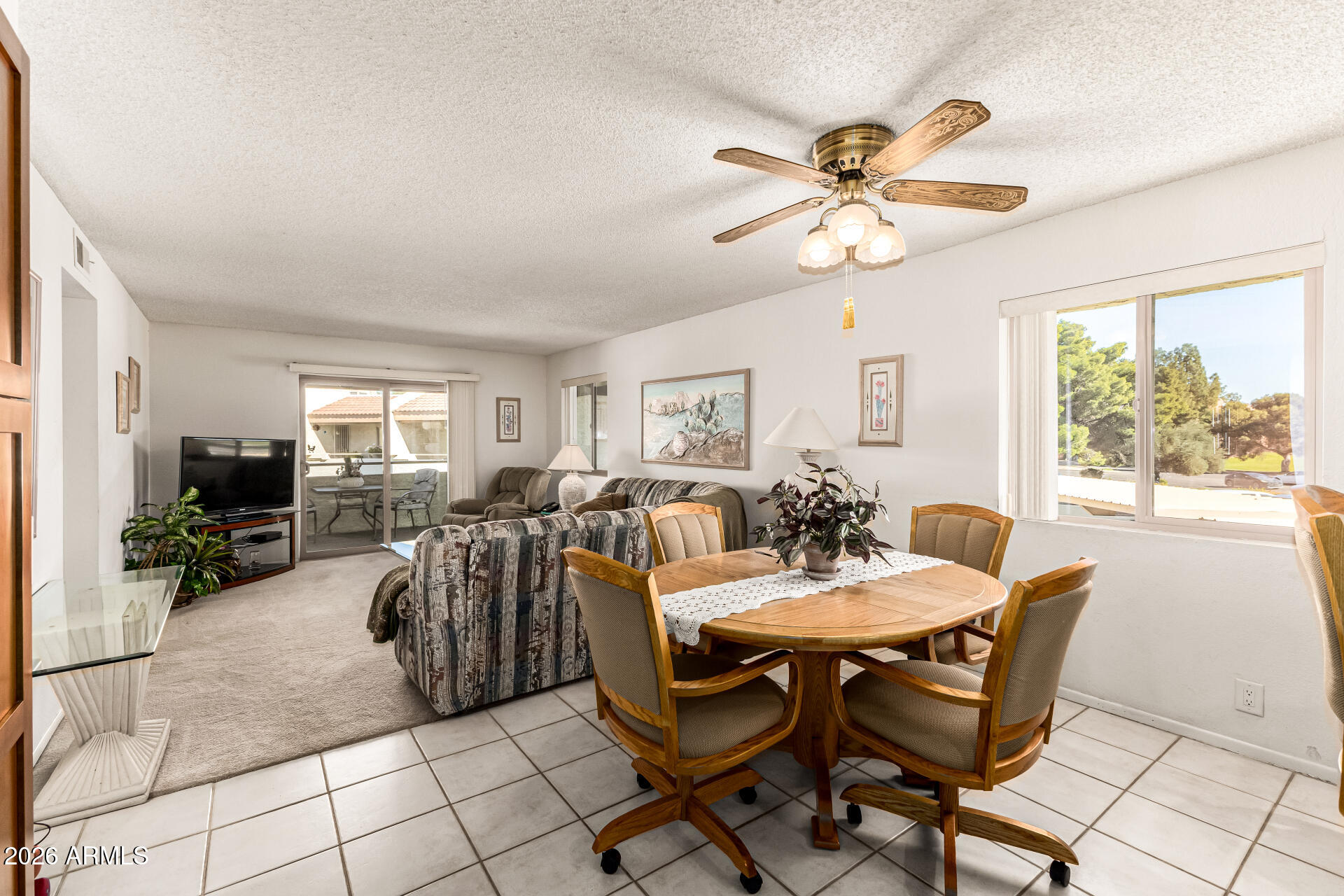 4150 East Cactus Road, Unit 210 Phoenix, AZ 85032 - Photo 4 of 45 a view of a dining room with furniture window and outside view