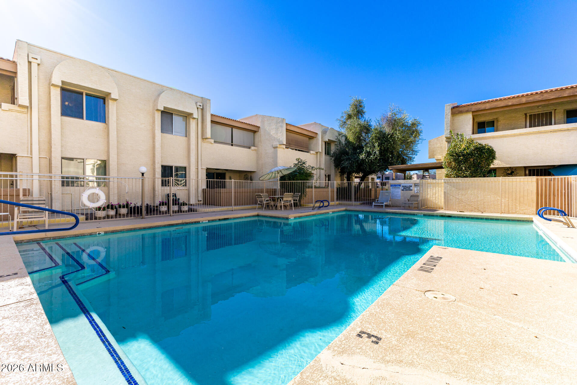 4150 East Cactus Road, Unit 210 Phoenix, AZ 85032 - Photo 44 of 45 a view of a swimming pool with outdoor seating