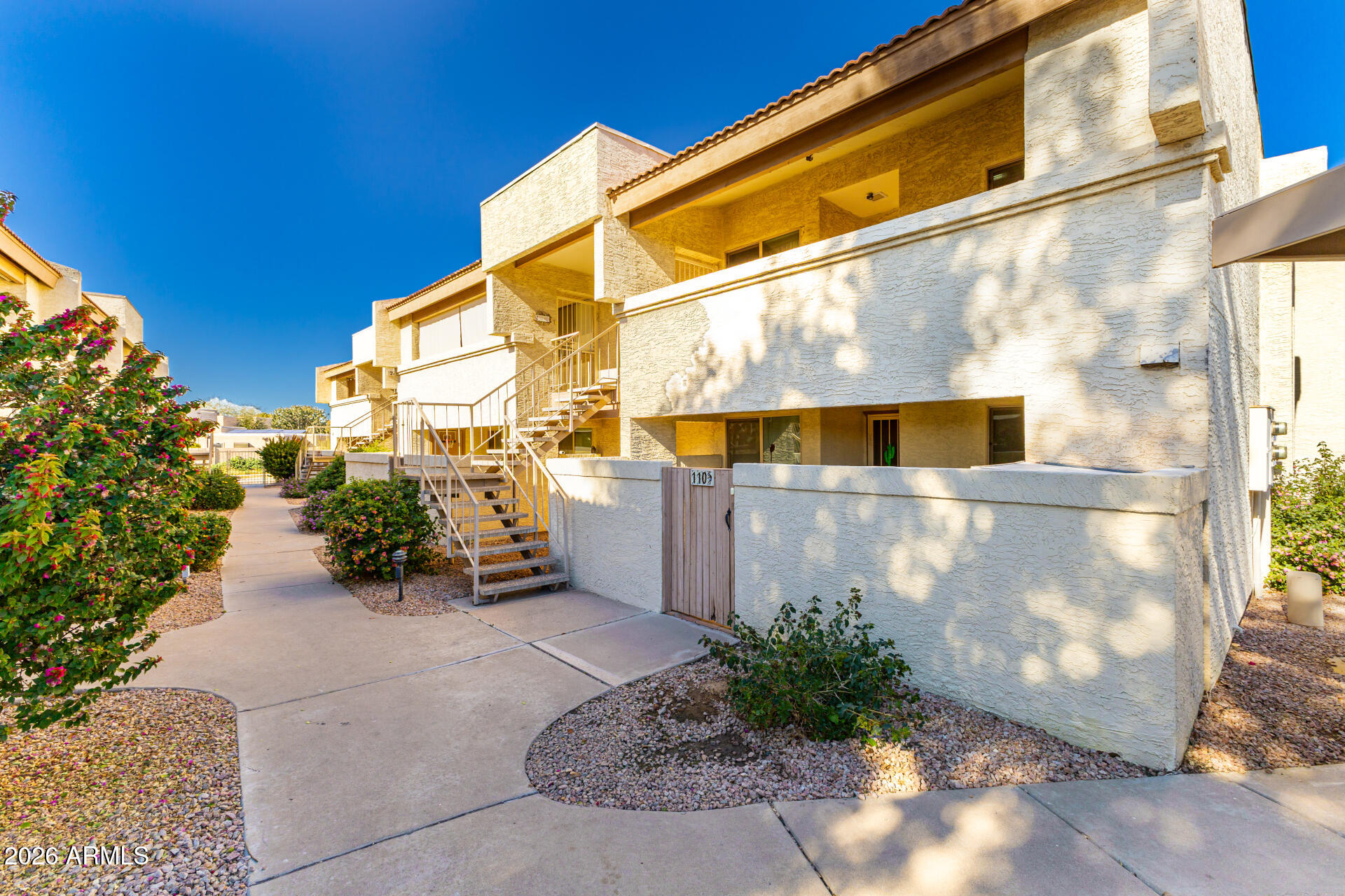 4150 East Cactus Road, Unit 210 Phoenix, AZ 85032 - Photo 7 of 45 a view of a street with potted plants