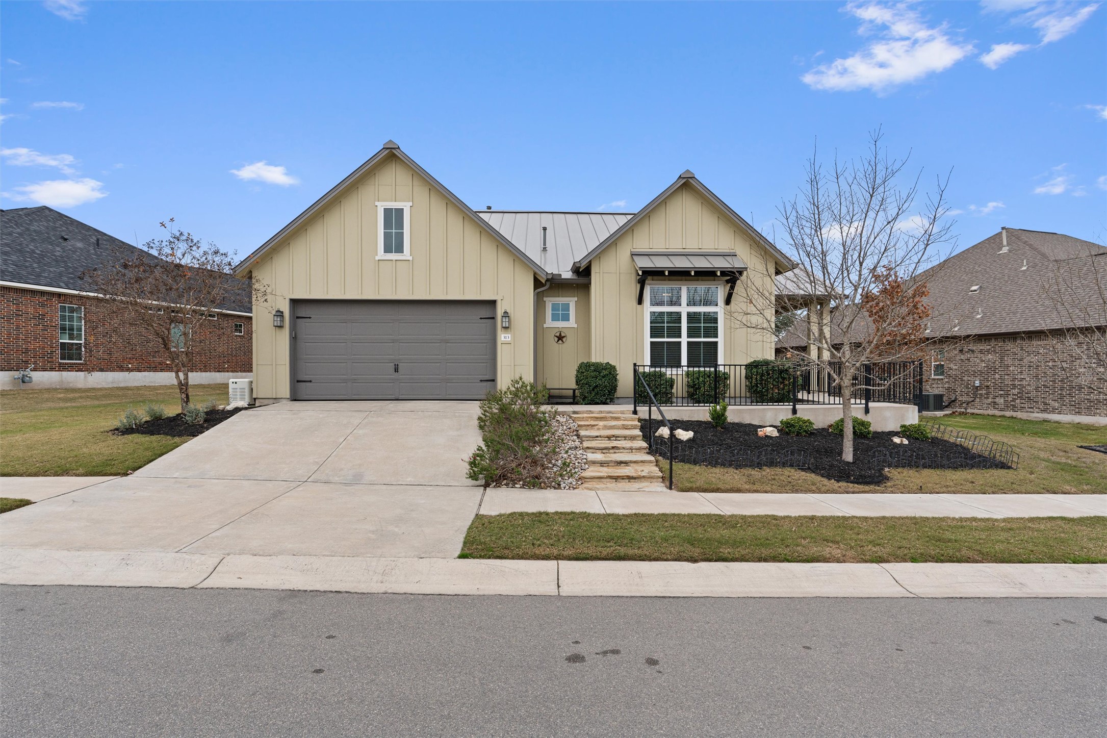 Modern Farmhouse with gorgeous curb appeal on an elevated lot.