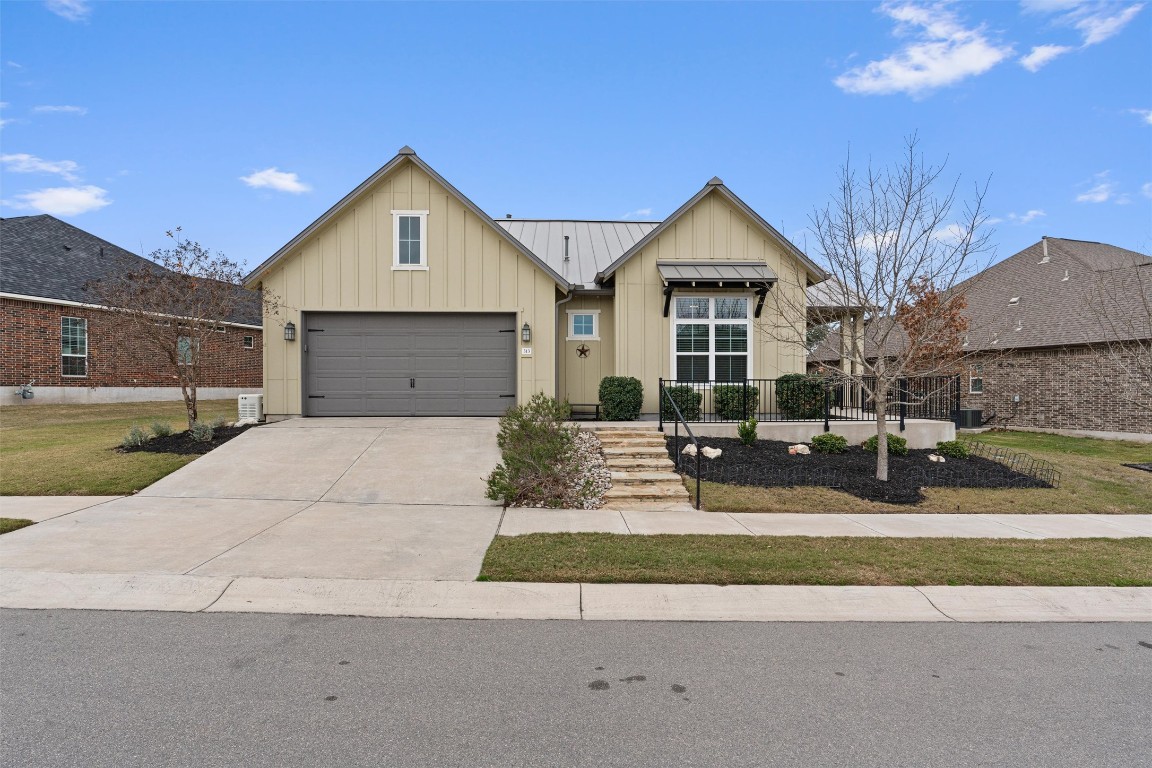 Modern Farmhouse with gorgeous curb appeal on an elevated lot.