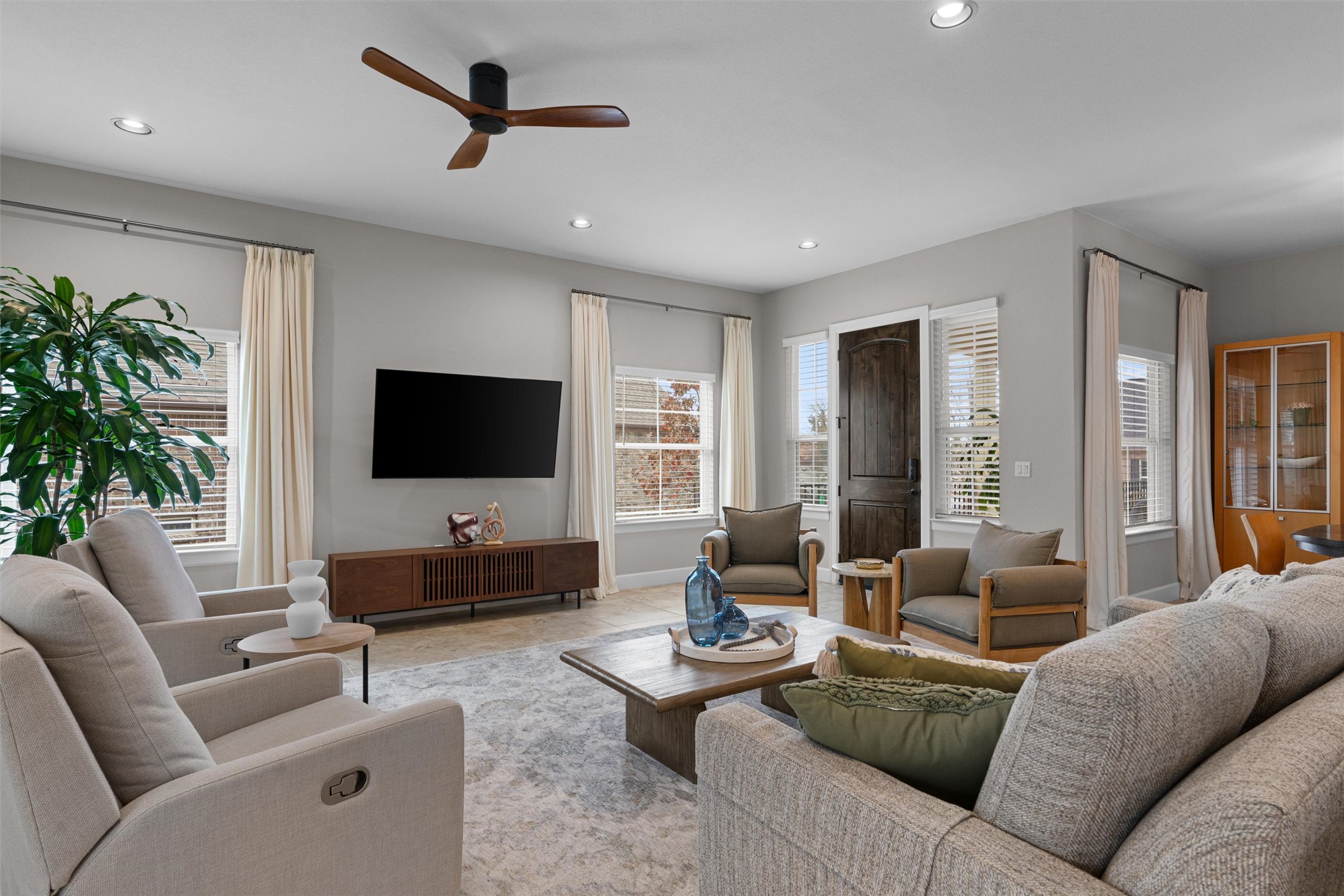 313 Racing Oak Loop San Marcos, TX 78666 - Photo 10 of 39 a living room with furniture and a flat screen tv