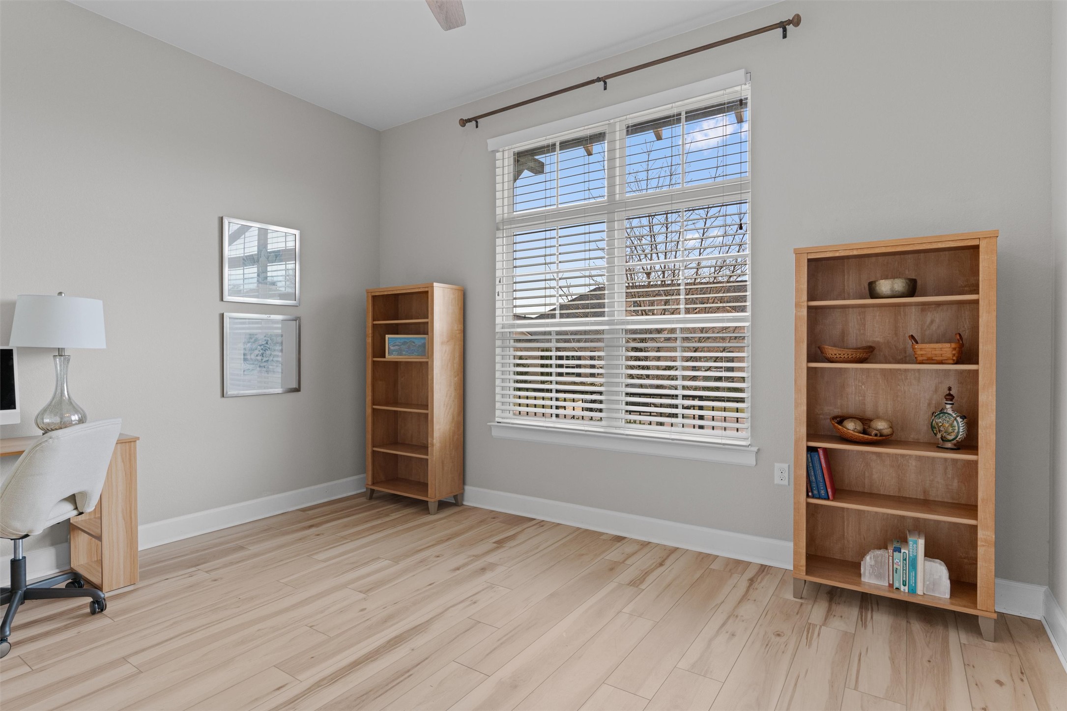 313 Racing Oak Loop San Marcos, TX 78666 - Photo 25 of 39 2nd bedroom at the front of the home for a split bedroom plan. This room has recent Luxury Vinyl Flooring