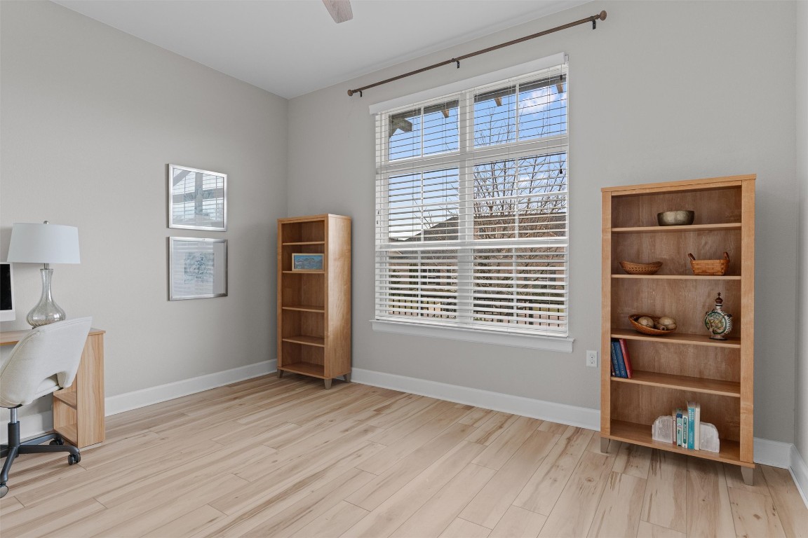 313 Racing Oak Loop San Marcos, TX 78666 - Photo 25 of 39 2nd bedroom at the front of the home for a split bedroom plan. This room has recent Luxury Vinyl Flooring