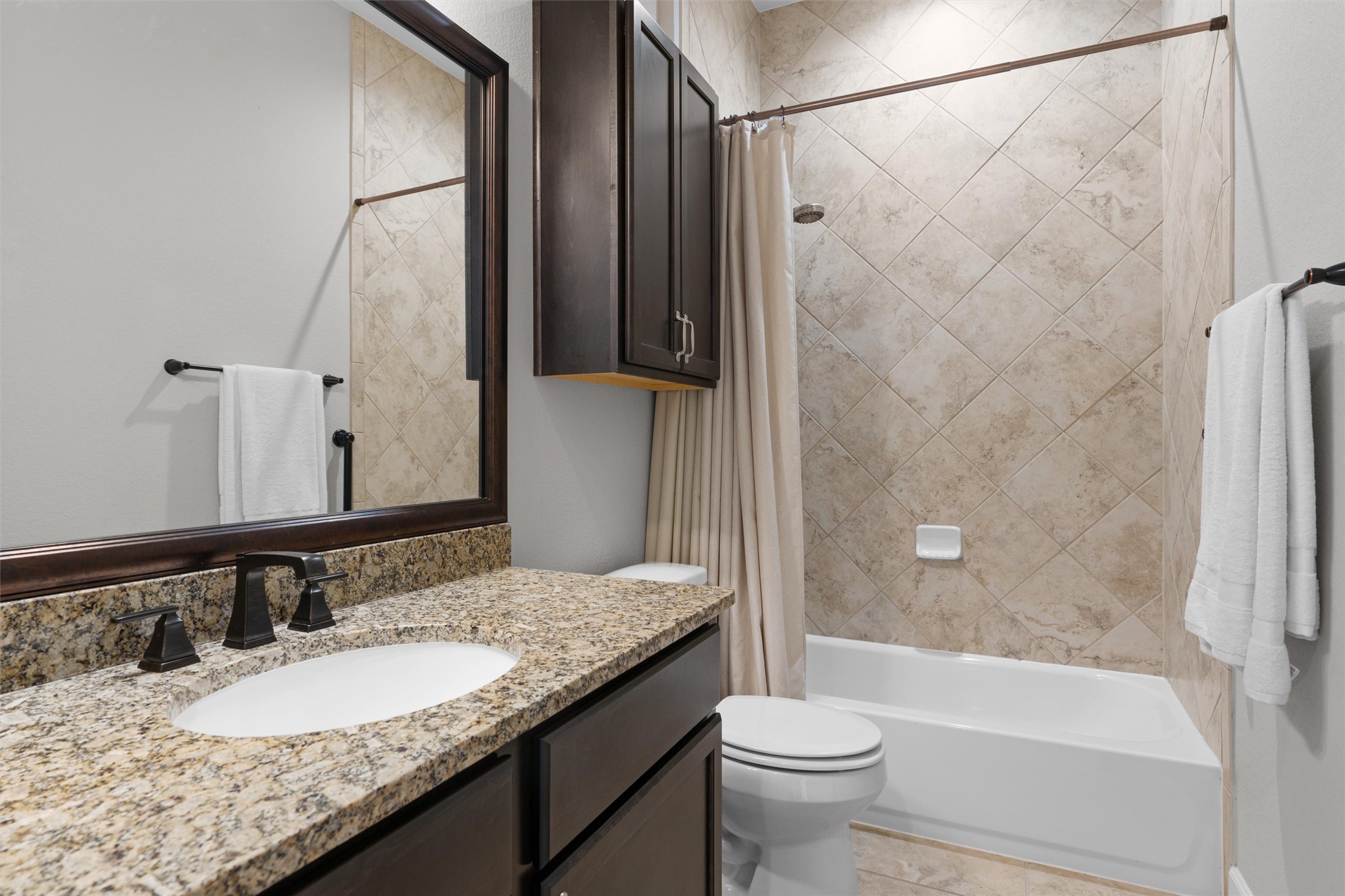 313 Racing Oak Loop San Marcos, TX 78666 - Photo 27 of 39 Guest bath is located adjacent to the 2nd bedroom and features a tub/shower and vanity with granite