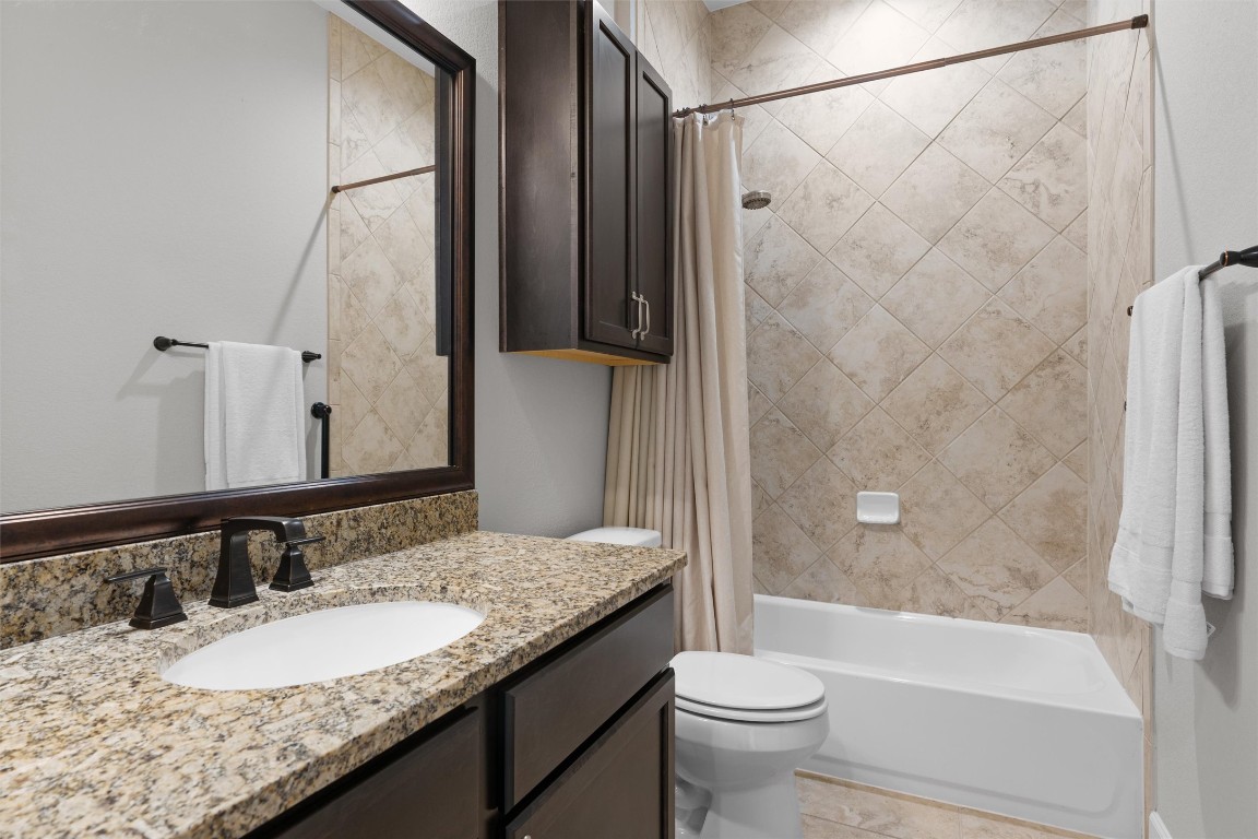 313 Racing Oak Loop San Marcos, TX 78666 - Photo 27 of 39 Guest bath is located adjacent to the 2nd bedroom and features a tub/shower and vanity with granite