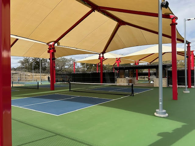 313 Racing Oak Loop San Marcos, TX 78666 - Photo 36 of 39 Kissing Tree has 18 pickleball courts, some are open and this is a picture of the covered courts