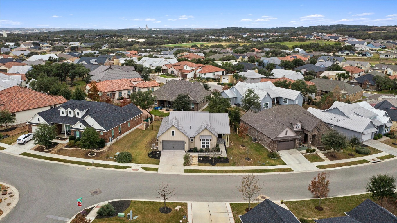 313 Racing Oak Loop San Marcos, TX 78666 - Photo 6 of 39 View of the home, large side yards and backyard with trees.