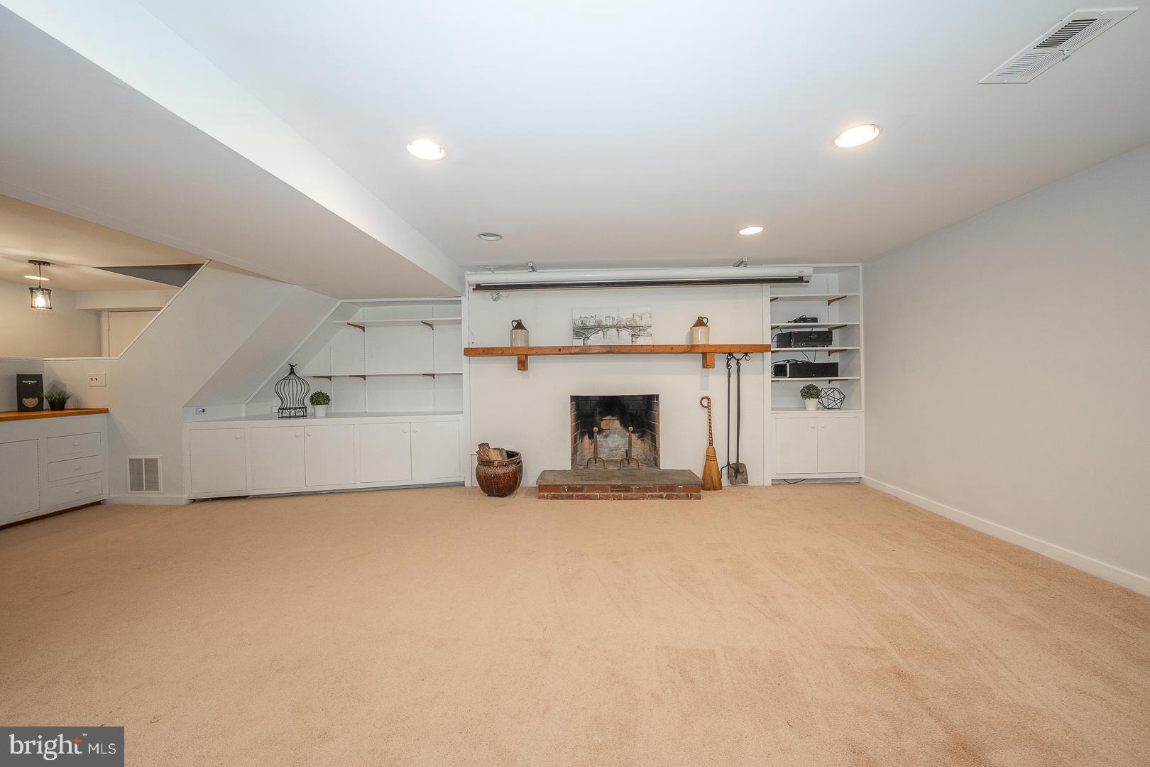 746 Mancill Road Wayne, PA 19087 - Photo 32 of 46 Lower level wood fireplace