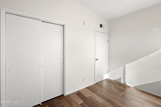 a view of a small space with wooden floor