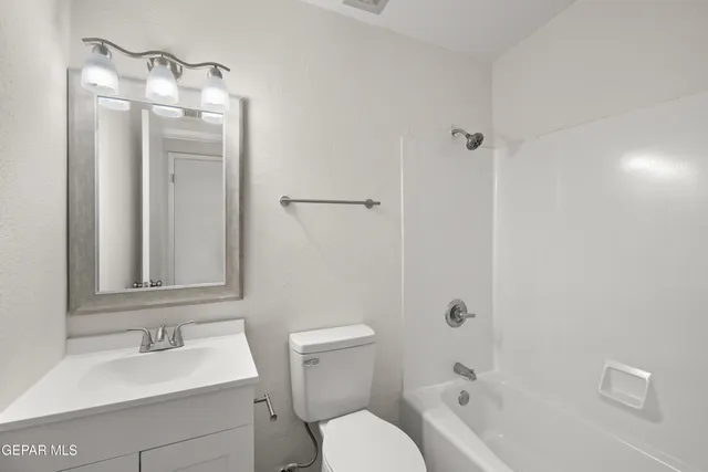 a bathroom with a toilet a sink and a bathtub