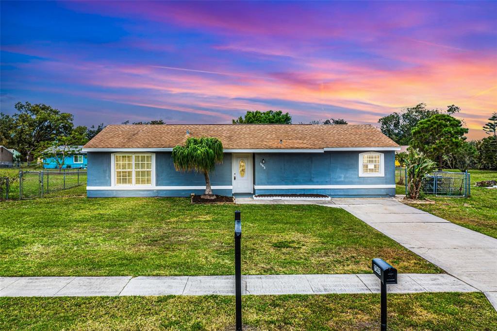 7543 Lyncrest Street North Port, FL 34287 - Photo 1 of 1 a view of a yard with a house in the background