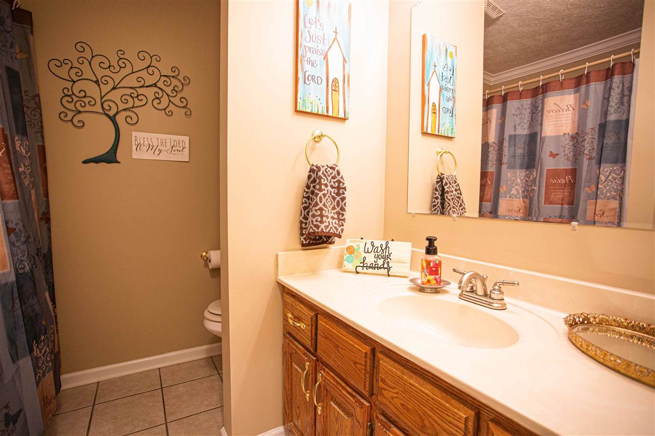 280 Church Street Ripley, TN 38063 - Photo 17 of 25 a bathroom with a sink and a mirror