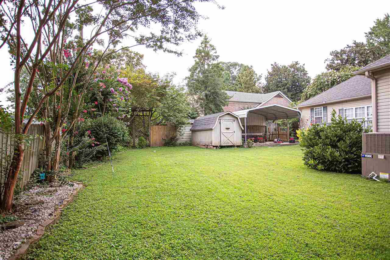 280 Church Street Ripley, TN 38063 - Photo 23 of 25 a view of a house with backyard and garden