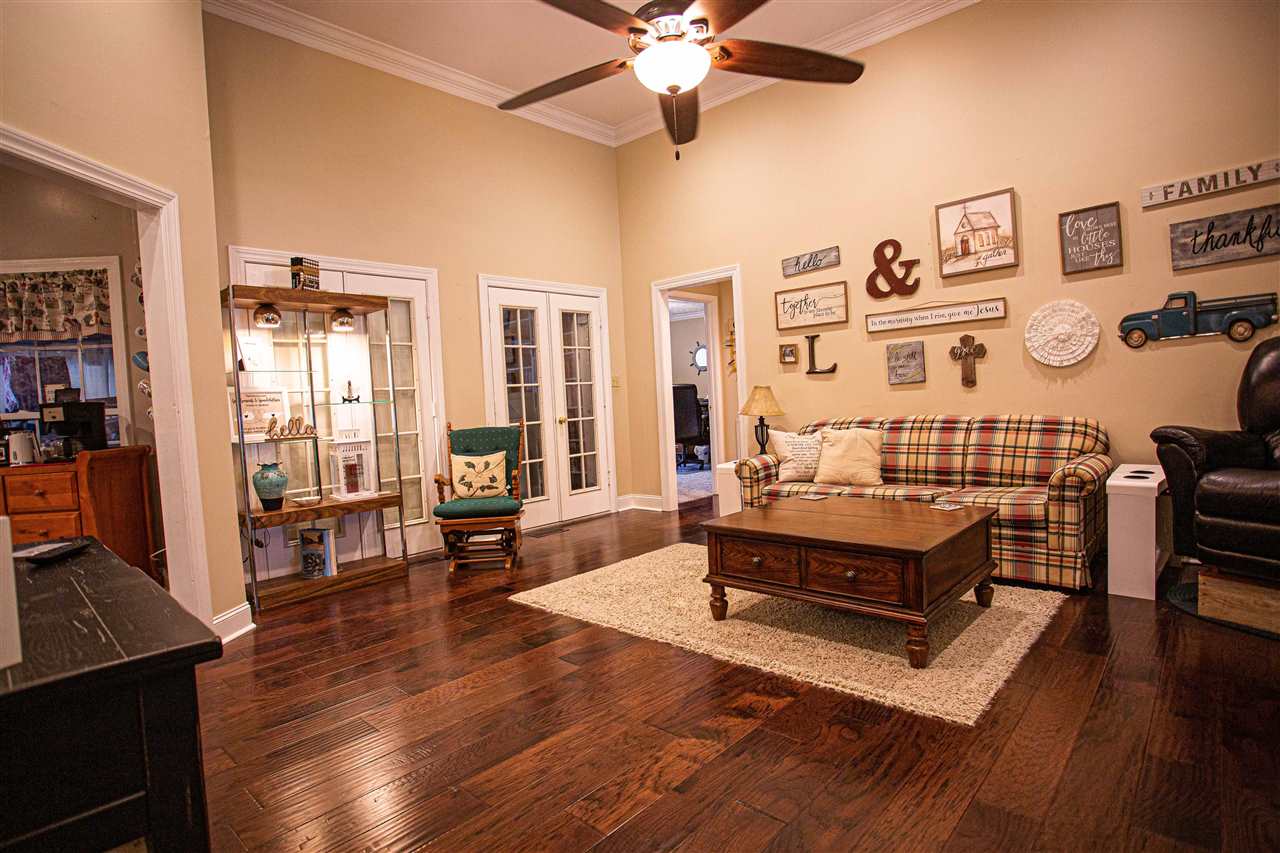 280 Church Street Ripley, TN 38063 - Photo 6 of 25 a living room with furniture and a wooden floor