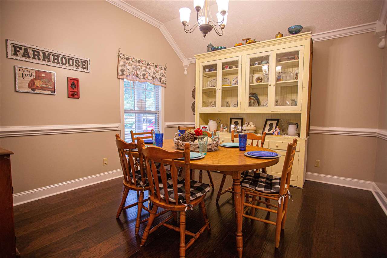 280 Church Street Ripley, TN 38063 - Photo 7 of 25 a view of a dining room with furniture window and wooden floor