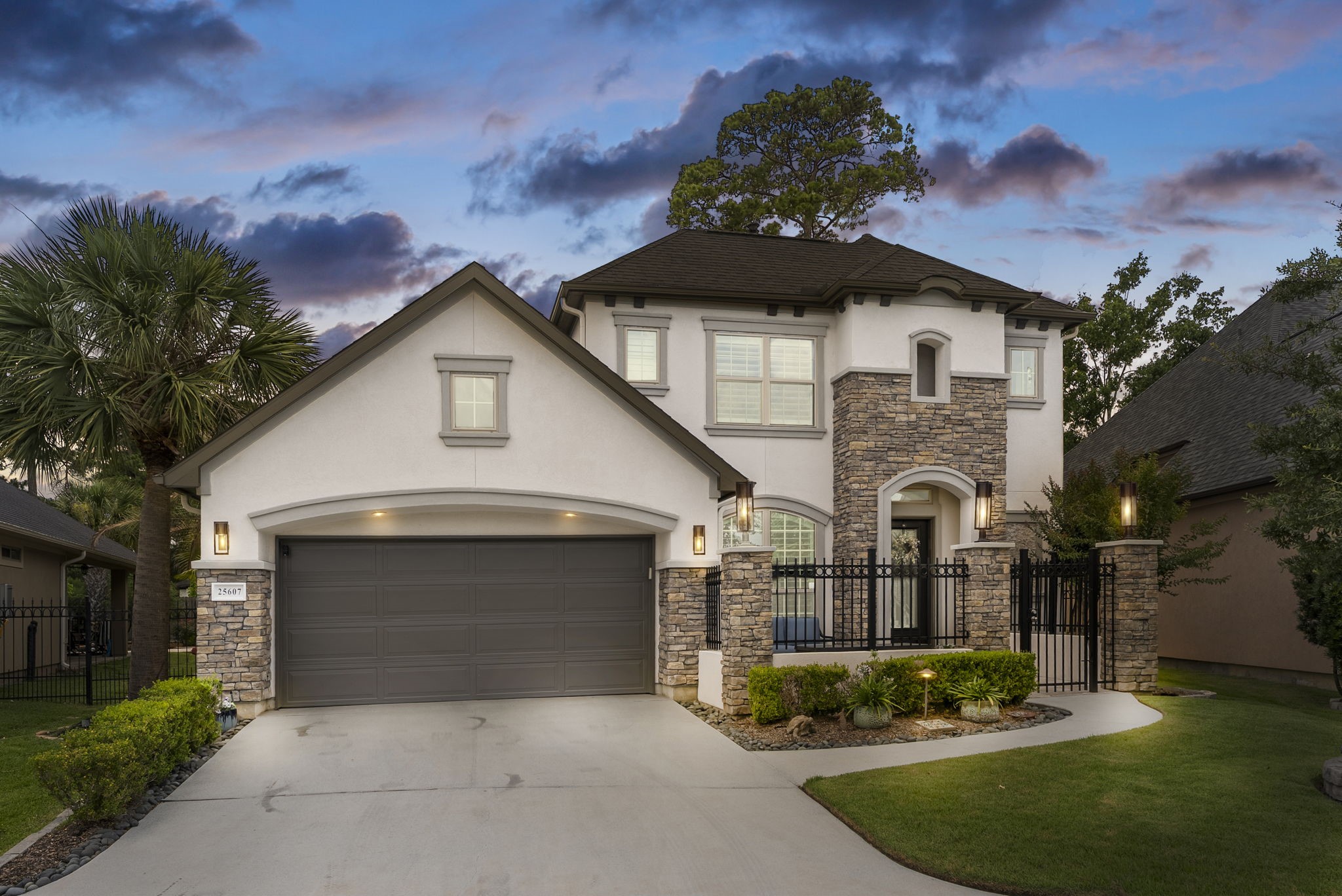 25607 Muirfield Bend Court Spring, TX 77389 - Photo 1 of 30 Stunning stone-and-stucco residence showcasing a private gated courtyard, timeless architectural details, and exceptional curb appeal in one of Spring's most desirable communities.