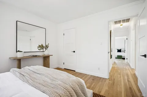 a bedroom with bed and window