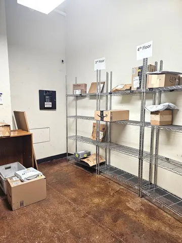 a view of a livingroom with furniture and a table