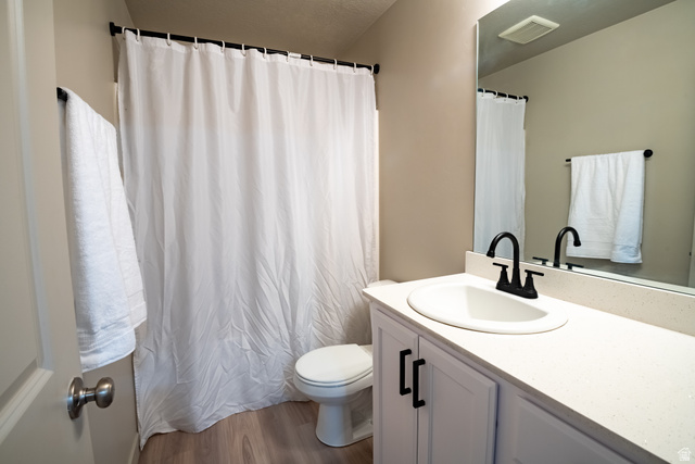 1787 North 1280 East Payson, UT 84651 - Photo 20 of 22 Bathroom featuring a white vanity with black hardware, an integrated sink, and a black faucet