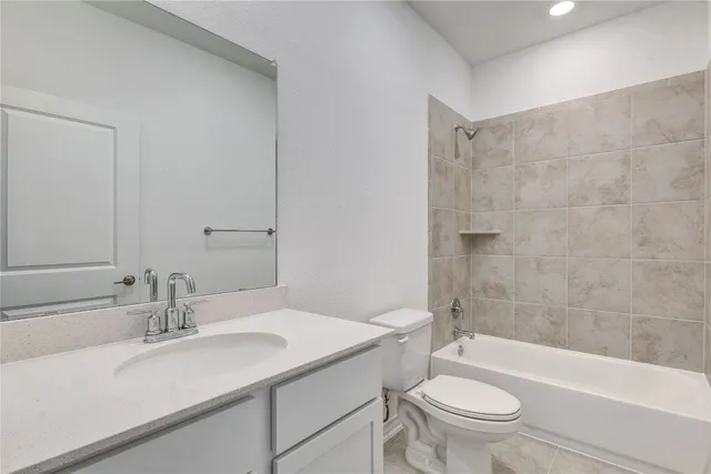 a bathroom with a sink a toilet and a bathtub