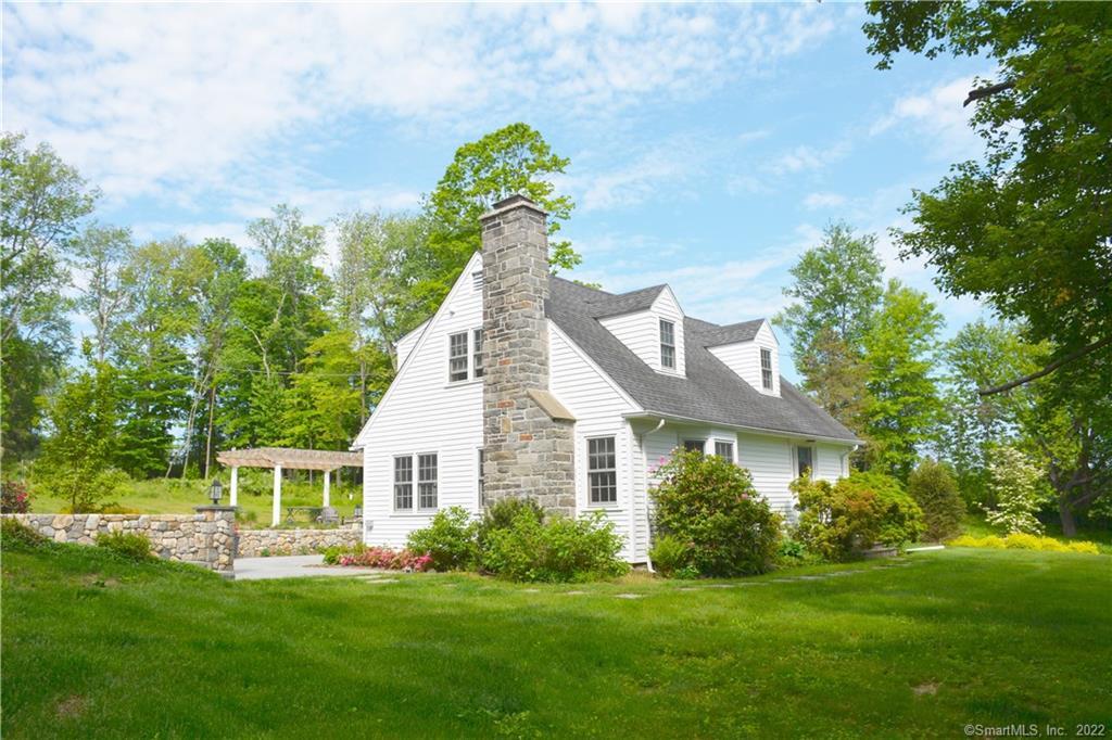 239 Southbury Road Roxbury, CT 06783 - Photo 1 of 1 a front view of a house with a yard and green space