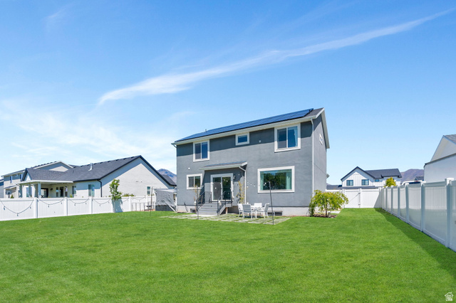 646 South Meade Street Mapleton, UT 84664 - Photo 31 of 46 Expansive green lawn with a white vinyl privacy fence
