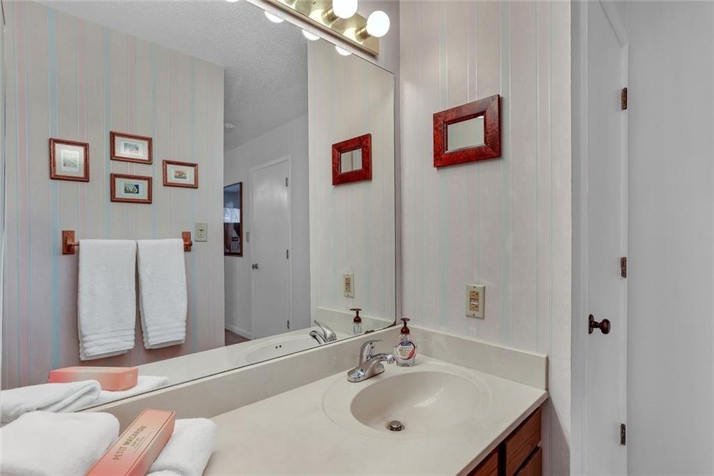 3445 Ivys Walk Atlanta, GA 30340 - Photo 13 of 21 a bathroom with a sink and a mirror