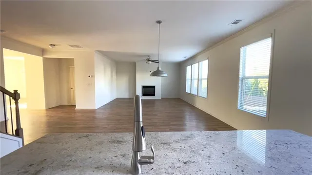 a view interior of a house with wooden floor and chandelier