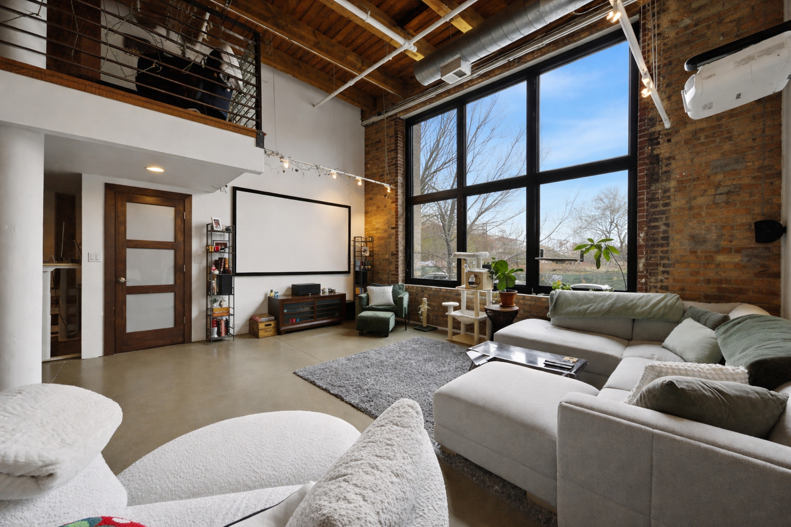 407 North Elizabeth Street, Unit 101B Chicago, IL 60642 - Photo 11 of 20 a living room with furniture and a floor to ceiling window