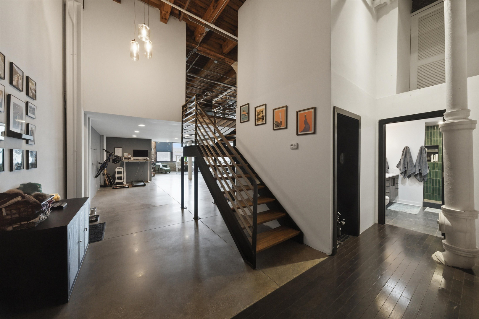 407 North Elizabeth Street, Unit 101B Chicago, IL 60642 - Photo 12 of 20 a view of a hallway with wooden floor and stairs