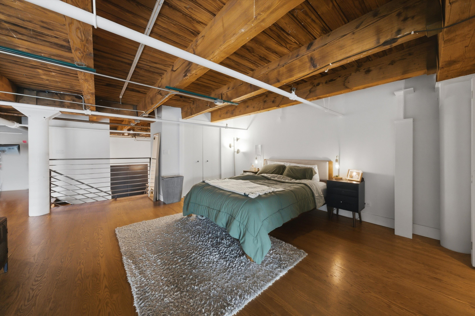 407 North Elizabeth Street, Unit 101B Chicago, IL 60642 - Photo 14 of 20 a bed room with a bed and a television
