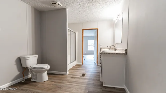 a bathroom with a toilet and a sink