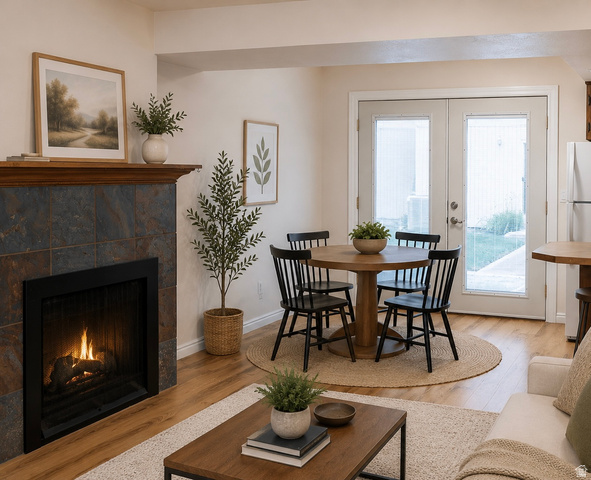 1269 North 400 East, Unit 3 Logan, UT 84341 - Photo 2 of 23 Open-concept living space with a fireplace featuring a tile surround and wood mantel