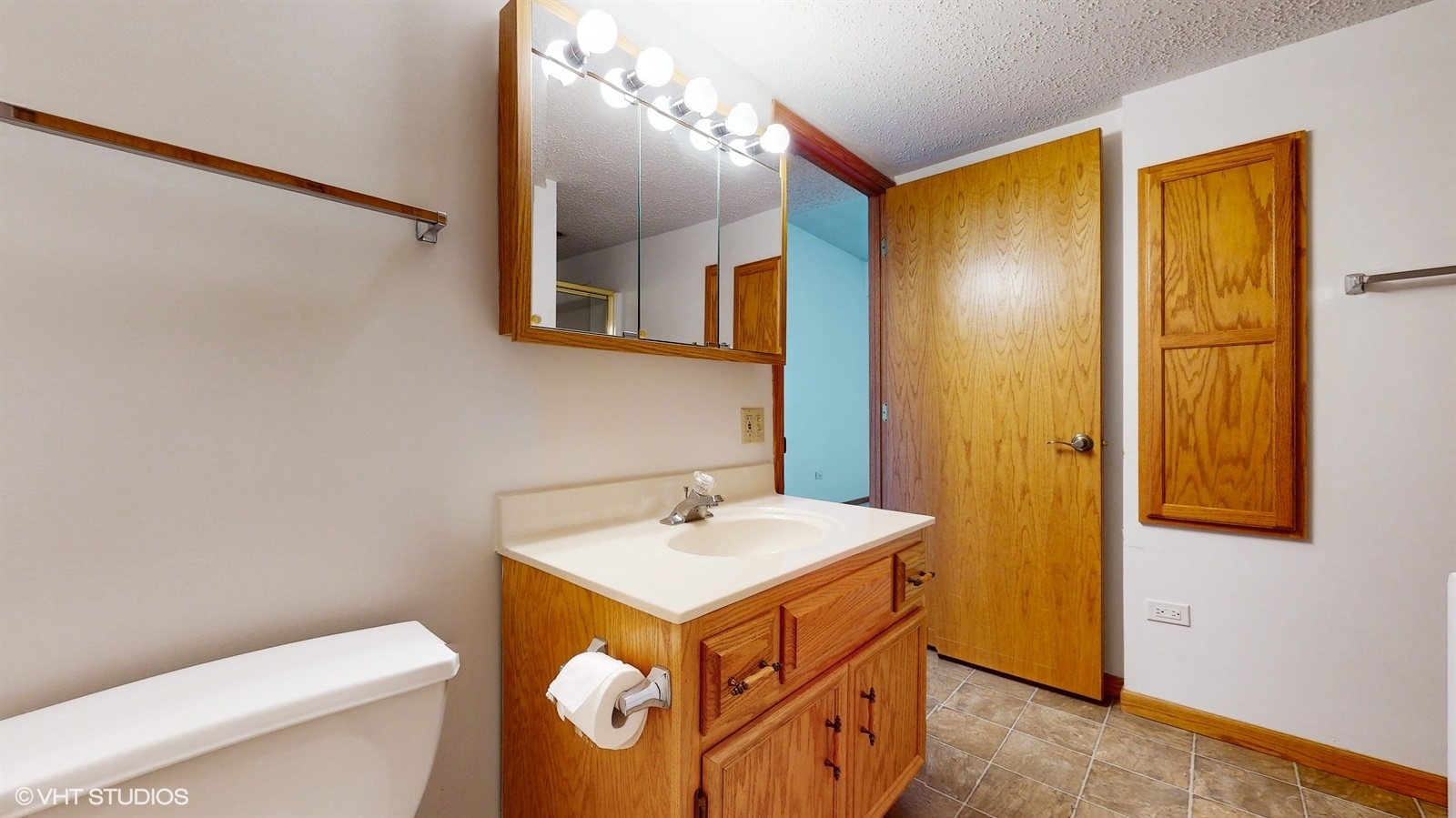 2851 West Heritage Drive, Unit 2C Joliet, IL 60435 - Photo 17 of 23 a bathroom with a sink mirror vanity and toilet