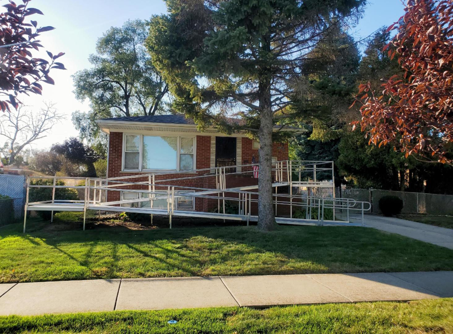 10912 Princess Avenue Chicago Ridge, IL 60415 - Photo 1 of 17 a front view of a house with a yard