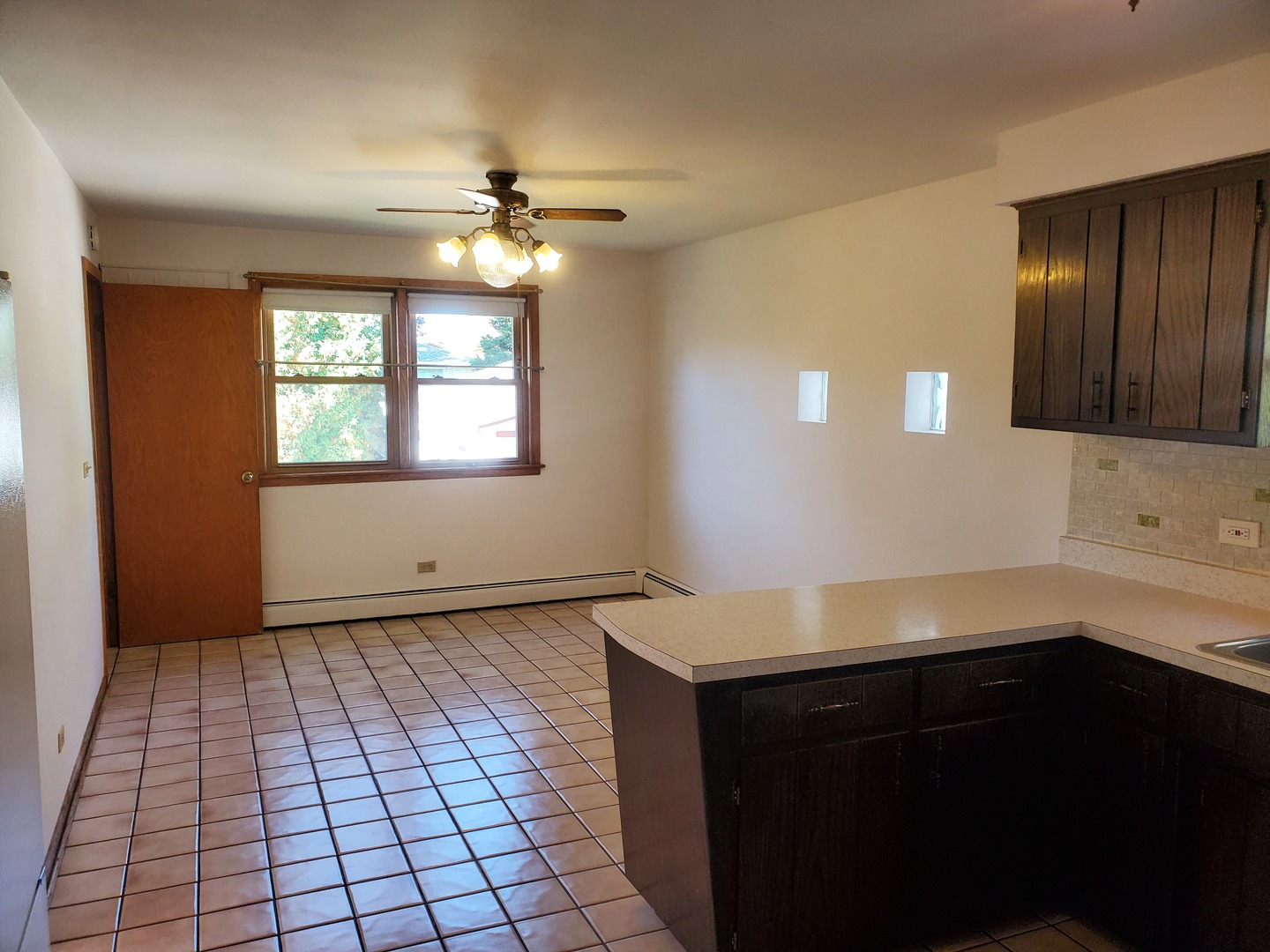 10912 Princess Avenue Chicago Ridge, IL 60415 - Photo 11 of 17 a view of an empty room with window and wooden floor