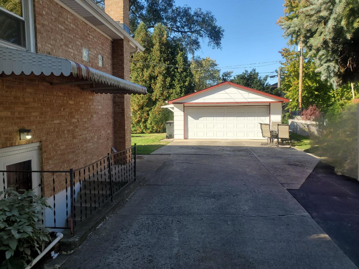 10912 Princess Avenue Chicago Ridge, IL 60415 - Photo 2 of 17 a front view of a house with a yard and garage